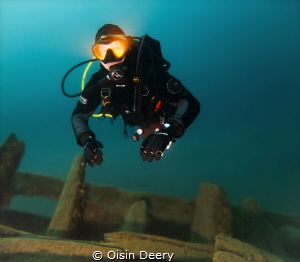Diver on the wreck of The King at 30m (100ft) depth in To... by Oisin Deery 